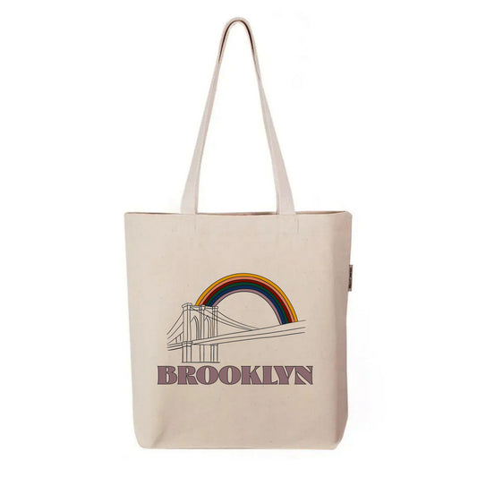Organic FYRNE cotton tote bag with line drawing of Brooklyn Bridge and warm-toned Irish rainbow