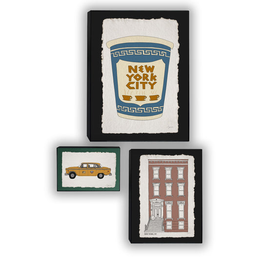 Set of three hand illustrated New York prints framed in black: yellow cab, coffee cup and brownstone.