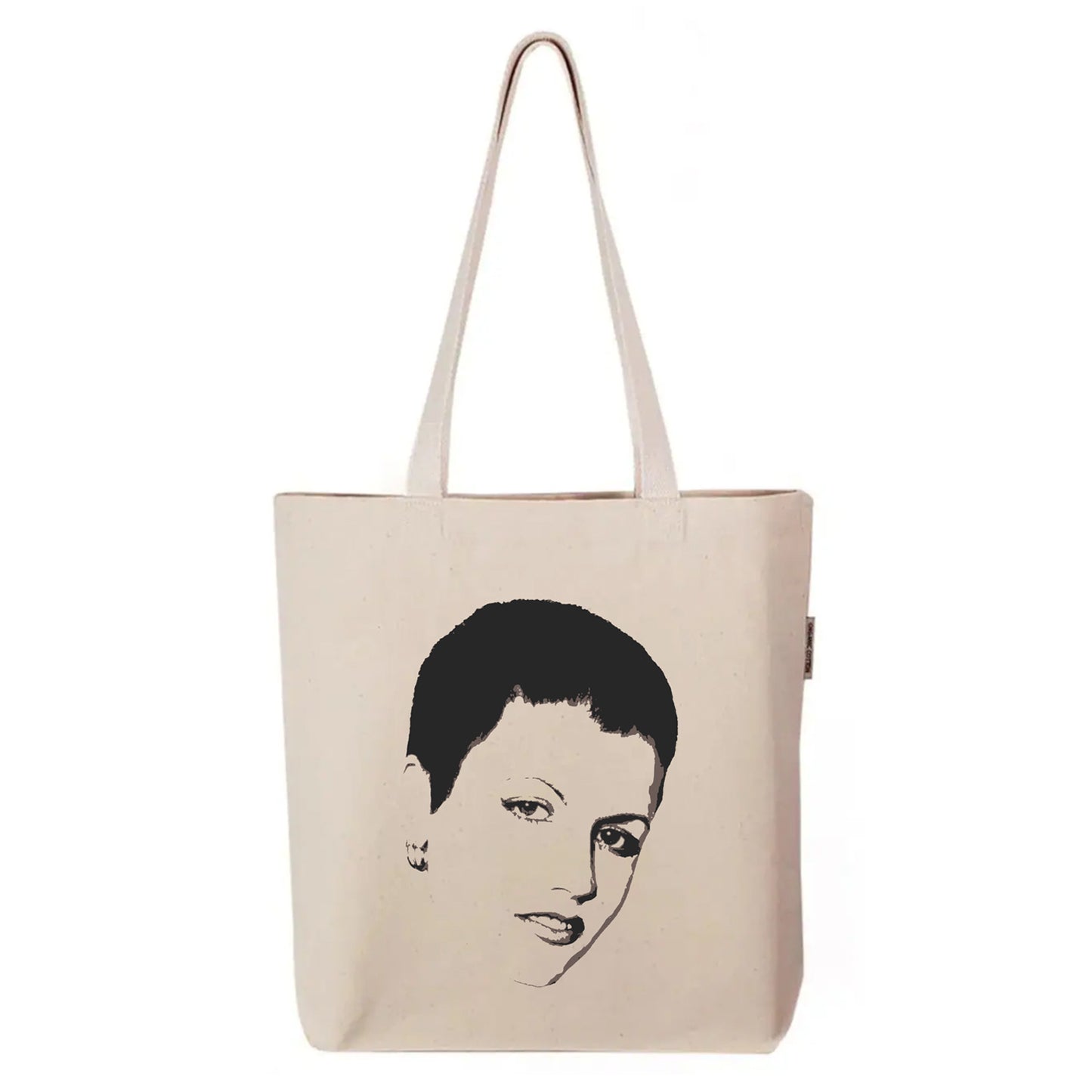 FYRNE Dolores O’Riordan tote bag — canvas accessory featuring minimalist portrait artwork inspired by the iconic voice of Ireland, perfect for music lovers and heritage design fans.